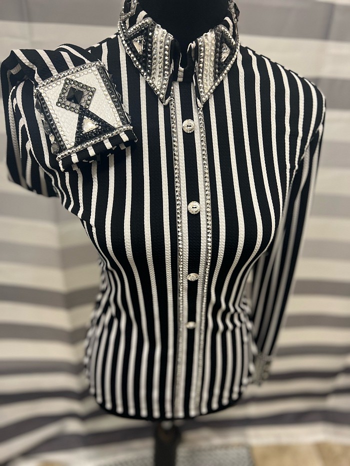 In on consignment made by Lionized Designs. In like new condition. This is a back zip. This fabric is super stretchy. Priced at $525 plus shipping. All sales final.  Bust 38-40  Waist 36  Hip 40  Sleeve 21.5  Shoulder 15